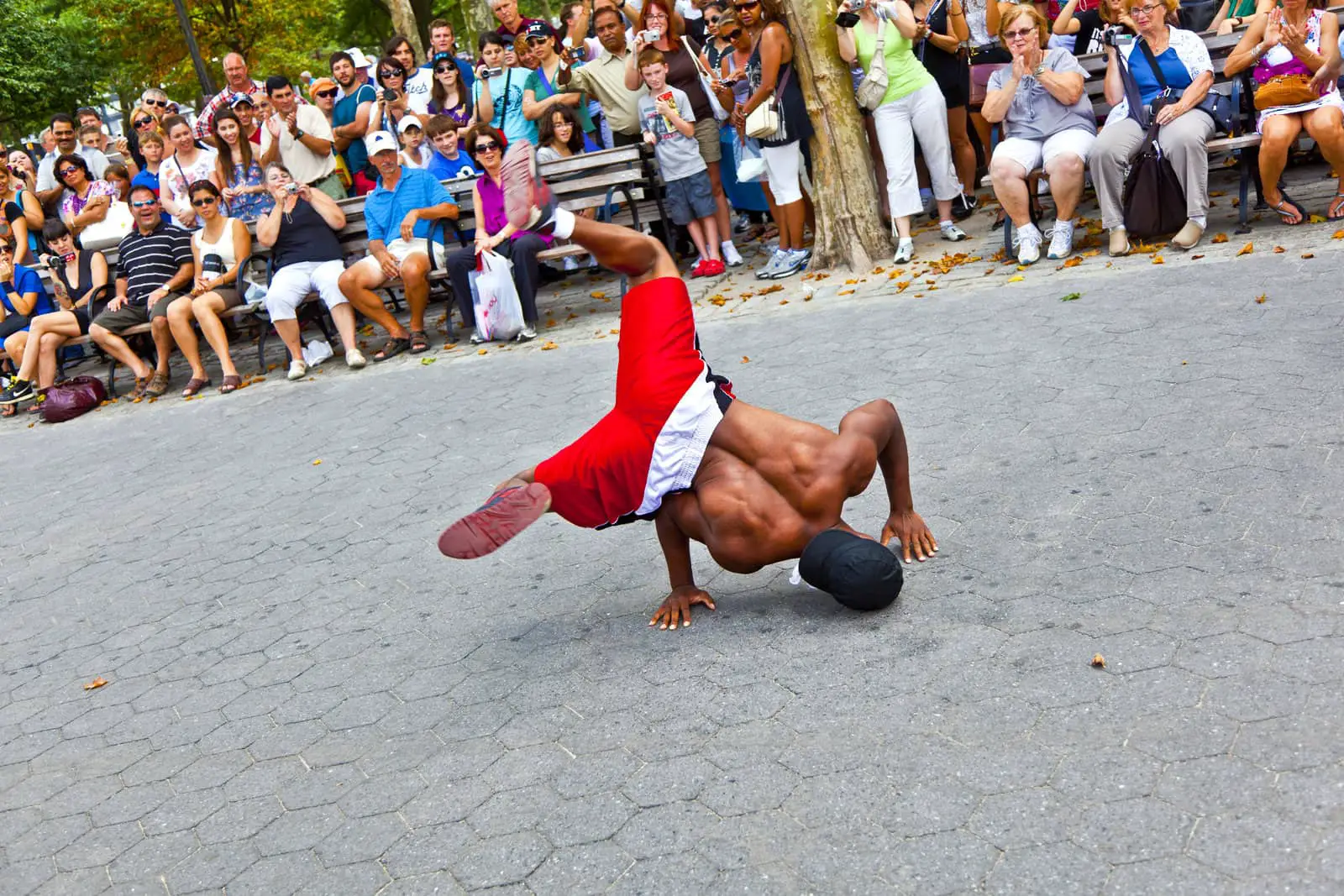 a man breakdancing as part of a hip hop show.